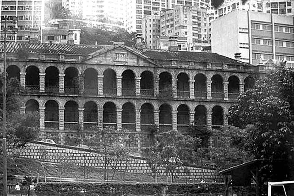 Photograph of the Old Mental Hospital on High Street, Sai Ying Pun — the baroque facade with arched verandas, now a community complex